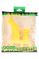 Ooze Steamboat silicone glass water pipe in bright yellow, packaged with quartz banger and 14 mm herb bowl in display box.
