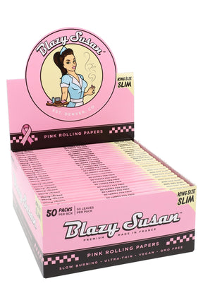 Blazy Susan King Size Slim pink rolling papers 50-count display box, ultra-thin vegan GMO-free sheets arranged in an open retail tray.