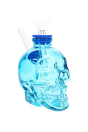Blue 4-inch skull glass bong with matching rimmed cap, clear funnel slide, and angled straw mouthpiece on white background
