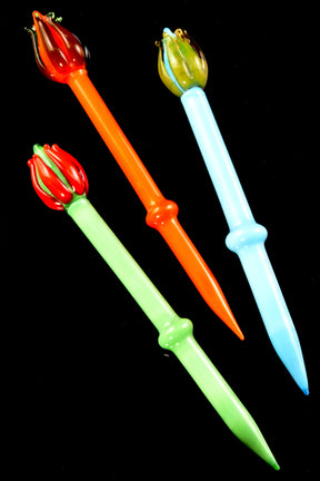 Torch-flame glass dab tools, 6-inch length, with red, olive, and lime flame toppers and matching stems, displayed on black backdrop to highlight vibrant colors.