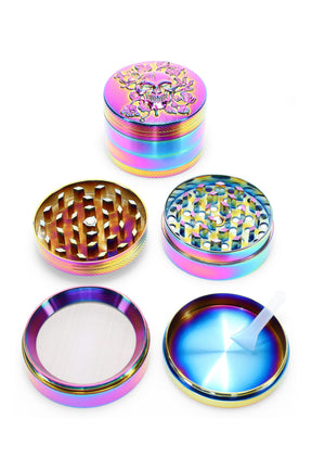 Rainbow 4-part metal herb grinder, 2″ (52 mm) with skull lid, mesh screen, and kief scraper shown disassembled.