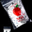 White Apple Bags bundle featuring repeating black mask / wolf-head icons with single bag for detail view