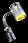 Side angle of domeless thermochromic quartz banger with 14.5 mm male joint and clear bucket on black background.
