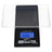Black WeighMax BLG-1000 pocket scale with blue backlit LCD reading 0.0 g, detachable clear tray over stainless platform.