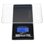 Black WeighMax BLG-1000 pocket scale with blue backlit LCD reading 0.0 g, detachable clear tray over stainless platform.