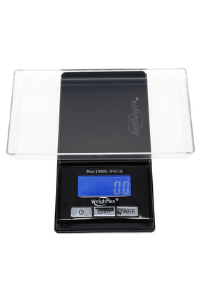 Black WeighMax BLG-1000 pocket scale with blue backlit LCD reading 0.0 g, detachable clear tray over stainless platform.
