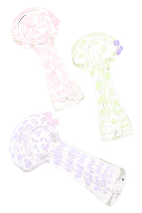 Compact 4″ clear glass spoon pipe with soft neon dot accents on the bowl and stem, shown in assorted pastel colorways.