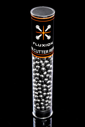 Close-up of Flux activated carbon refill tube on glossy black background, highlighting packed silver beads