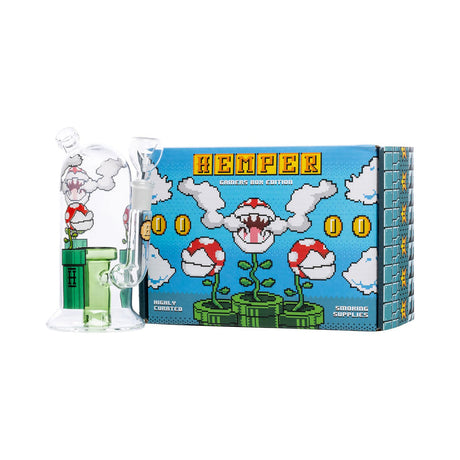Compact Hemper Gaming Flower 7″ bong displayed beside its blue gamers edition box, straight-on studio view highlighting retro pixel artwork and green perc.