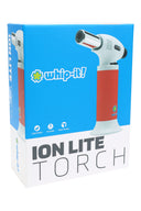 Ion Lite torch white body with red grip on box; compact dab torch with polished nozzle, slightly left-facing.