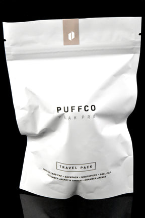 Puffco Peak Pro Travel Pack retail pouch, sealed white bag labeled “Travel Pack” with contents list printed below.