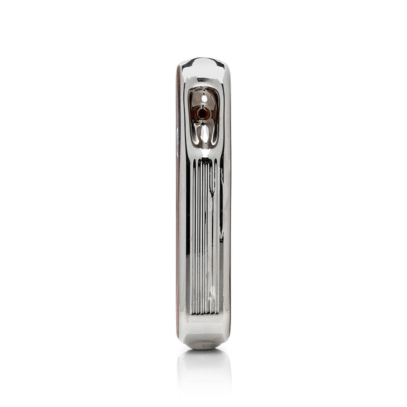 Side profile of metallic army knife style glass hand pipe highlighting ridged trim and recessed bowl on the top panel.