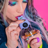 Ooze Hover vaporizer with removable protective mouthpiece cover displayed beneath lavender device