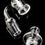 Quartz spinner banger with thick bottom base and included turbine carb cap; clean clear finish on black backdrop.