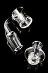 Quartz spinner banger with thick bottom base and included turbine carb cap; clean clear finish on black backdrop.