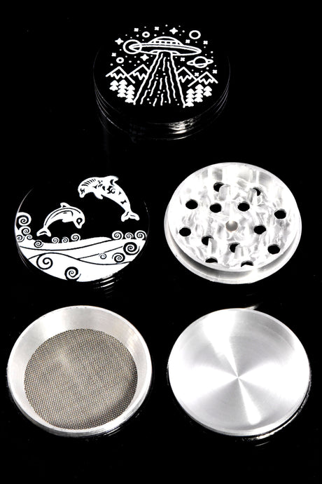 Four-piece black aluminum herb grinder disassembled to show diamond-style teeth, kief screen, and pollen catcher components.