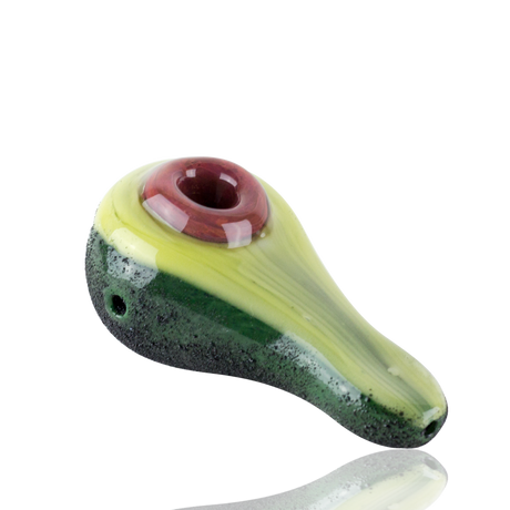 Top view of 4½″ avocado hand pipe with black background, pit-style bowl, and speckled rind texture