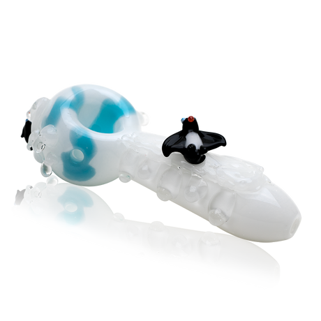 Side profile of 4½″ glass hand pipe showing aqua ice-like marbles and penguin-themed details