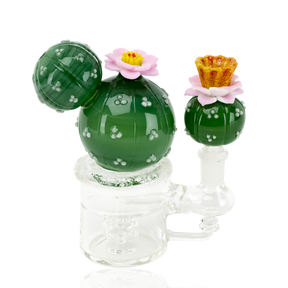 Cactus glass mini rig with green orb body, pink flowers, amber mouthpiece, and 14.5 mm female joint