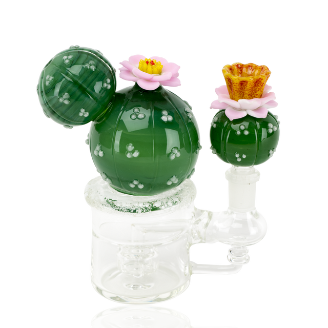 Cactus glass mini rig with green orb body, pink flowers, amber mouthpiece, and 14.5 mm female joint